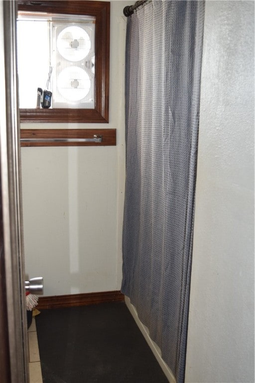 bathroom with tile patterned flooring