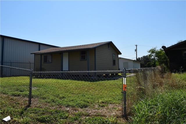 view of home's exterior with a yard