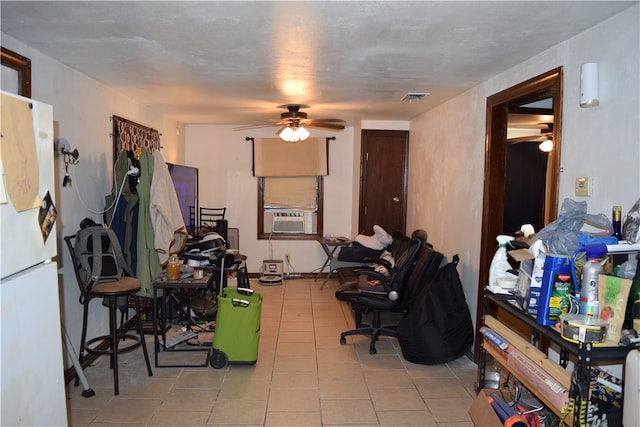 interior space with cooling unit, ceiling fan, and light tile patterned floors