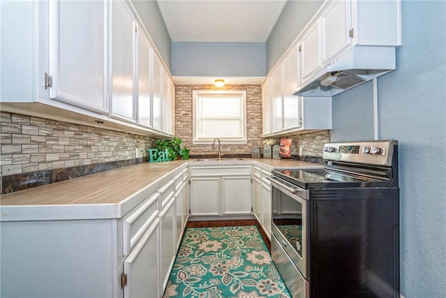 10634 Veda Dr, Corpus Christi, TX 78410 - kitchen featuring electric stove, under cabinet range hood, backsplash, white cabinetry, and a textured wall