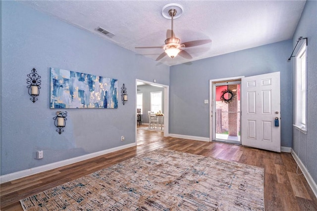 10634 Veda Dr, Corpus Christi, TX 78410 - foyer with healthy amount of natural light, wood finished floors, a ceiling fan, and a textured ceiling