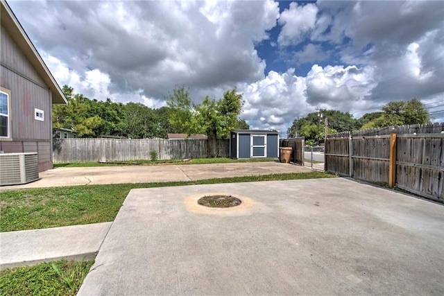 10634 Veda Dr, Corpus Christi, TX 78410 - fenced backyard with a storage unit and a patio area