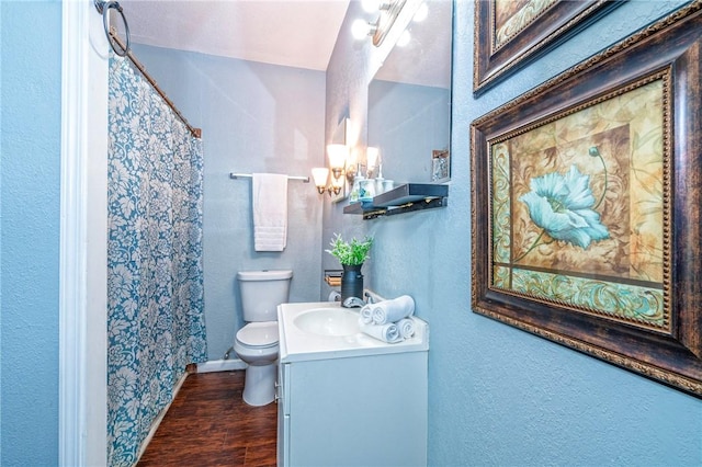 10634 Veda Dr, Corpus Christi, TX 78410 - full bathroom featuring a chandelier, vanity, curtained shower, a textured wall, and wood finished floors