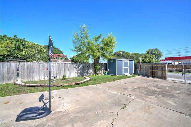 10634 Veda Dr, Corpus Christi, TX 78410 - view of patio with a storage unit, a fenced backyard, and an outbuilding