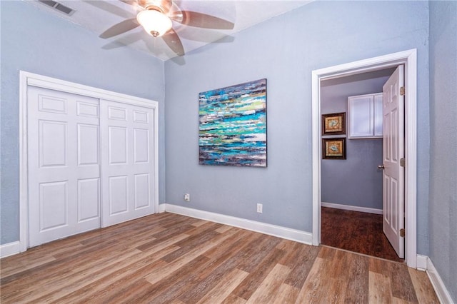 10634 Veda Dr, Corpus Christi, TX 78410 - unfurnished bedroom featuring wood finished floors, a closet, and a ceiling fan