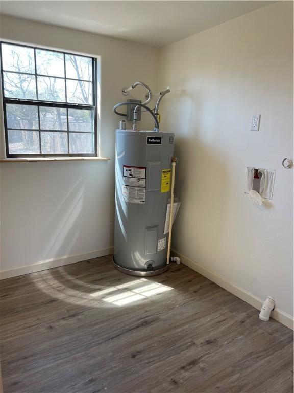 utility room with electric water heater