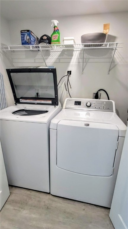 washroom featuring washer and dryer