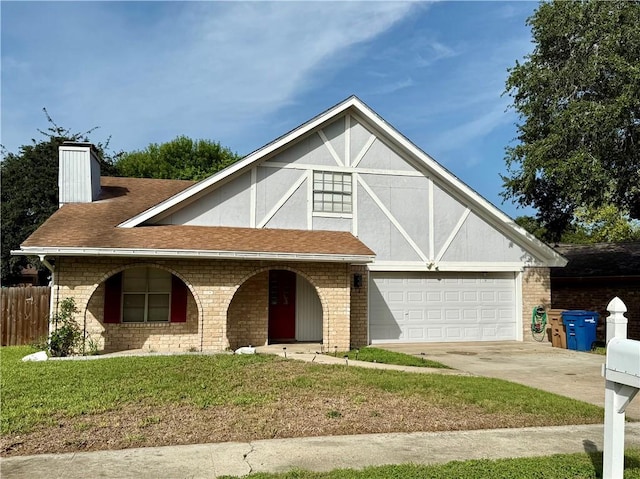 11614 Coleta Creek Dr, Corpus Christi, TX 78410 - english style home with covered porch, a chimney, driveway, roof with shingles, and brick siding
