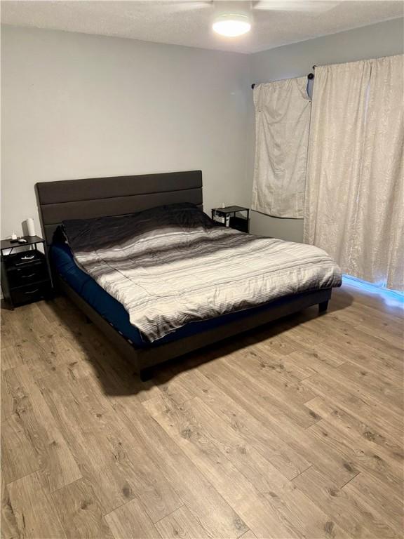 11614 Coleta Creek Dr, Corpus Christi, TX 78410 - bedroom featuring wood finished floors