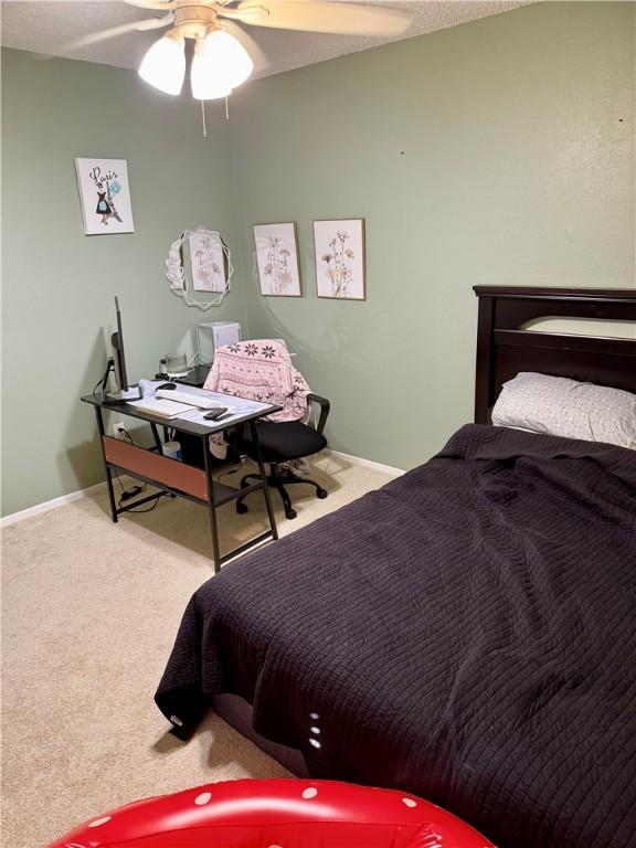 11614 Coleta Creek Dr, Corpus Christi, TX 78410 - carpeted bedroom featuring ceiling fan and baseboards