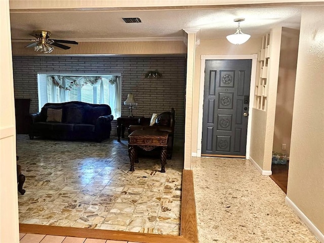 4725 Shea Pkwy, Corpus Christi, TX 78413 - foyer entrance with visible vents, baseboards, a ceiling fan, and ornamental molding