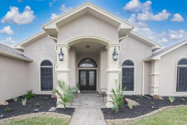 property entrance featuring french doors