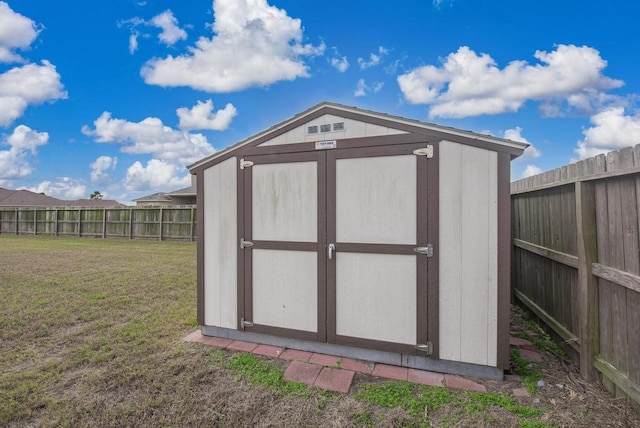 view of outdoor structure with a yard