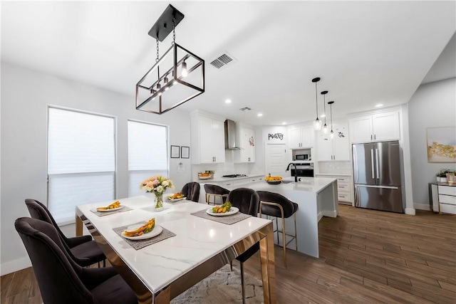 dining area with recessed lighting, visible vents, baseboards, and dark wood-style flooring