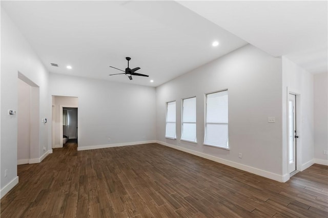 empty room featuring recessed lighting, visible vents, baseboards, and dark wood-type flooring