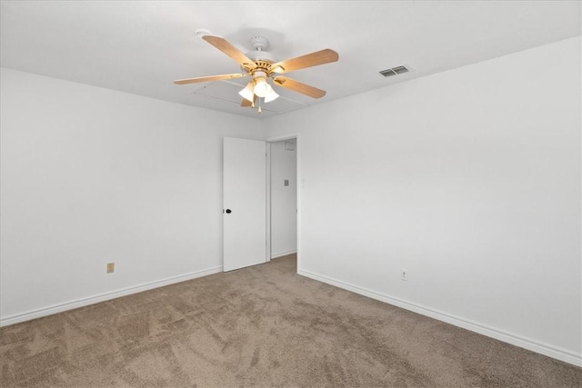 empty room with ceiling fan and carpet