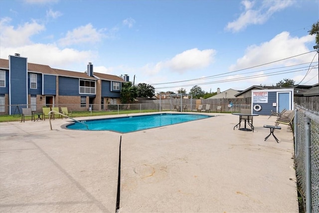 view of pool featuring a patio