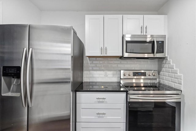 kitchen with backsplash, white cabinetry, and stainless steel appliances