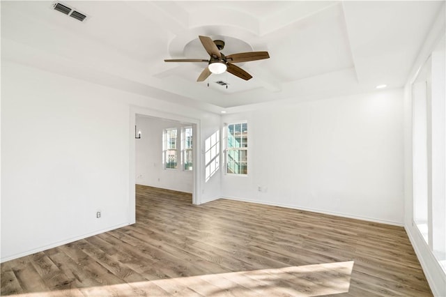 unfurnished room with hardwood / wood-style flooring and ceiling fan