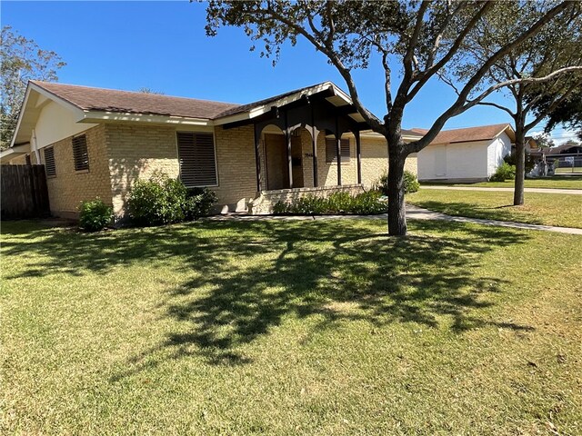 ranch-style house with a front lawn