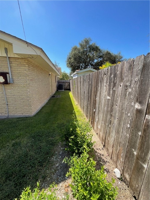 view of yard featuring central AC unit