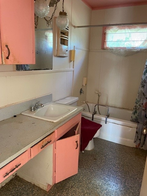 bathroom with shower / tub combo and vanity