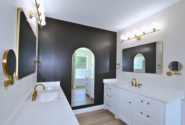 bathroom with vanity and hardwood / wood-style flooring