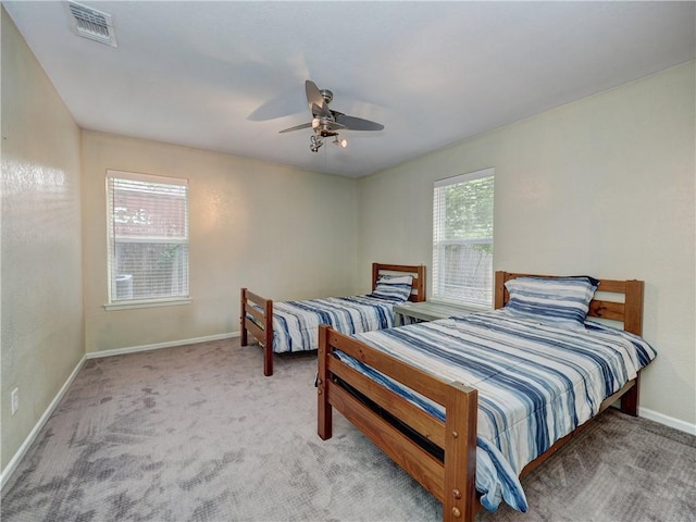 1305 S Whitney St, Aransas Pass, TX 78336 - carpeted bedroom with baseboards and ceiling fan