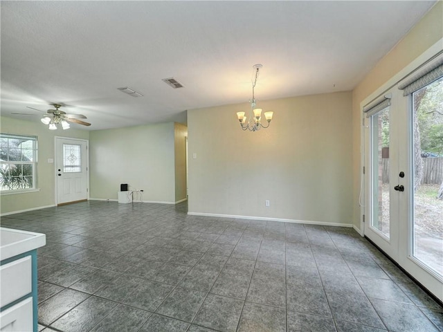 1305 S Whitney St, Aransas Pass, TX 78336 - empty room featuring a chandelier, healthy amount of natural light, baseboards, and ceiling fan