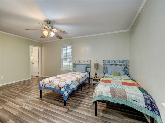 1305 S Whitney St, Aransas Pass, TX 78336 - bedroom with wood finished floors, crown molding, baseboards, and ceiling fan