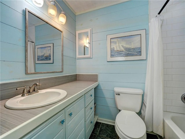 1305 S Whitney St, Aransas Pass, TX 78336 - full bath with toilet, vanity, shower / bath combo, and wood walls