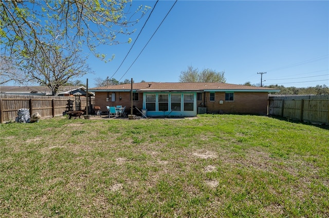 rear view of house with a patio area and a yard