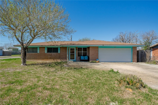 single story home featuring a garage and a front yard