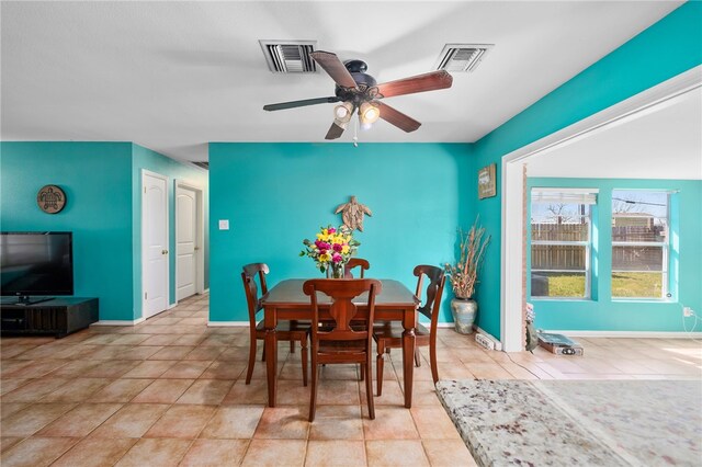 dining room featuring light tile patterned floors and ceiling fan