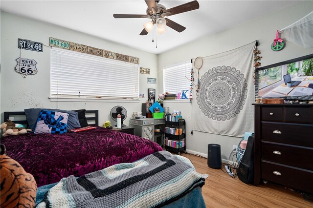 bedroom featuring light hardwood / wood-style floors and ceiling fan