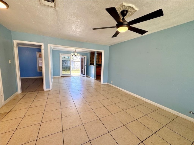 unfurnished room with a textured ceiling, visible vents, baseboards, ceiling fan with notable chandelier, and light tile patterned floors