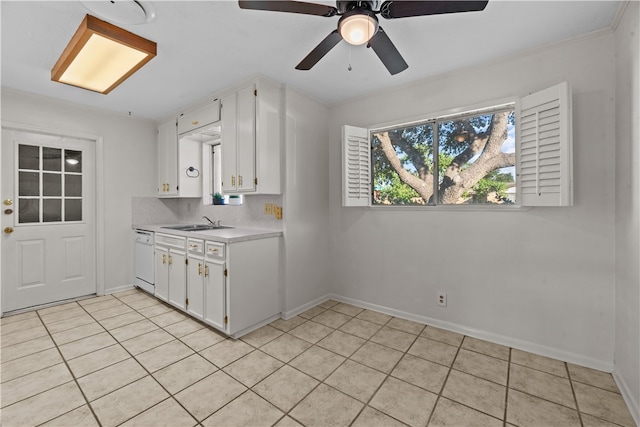 kitchen featuring dishwasher, backsplash, light tile patterned floors, and white cabinets