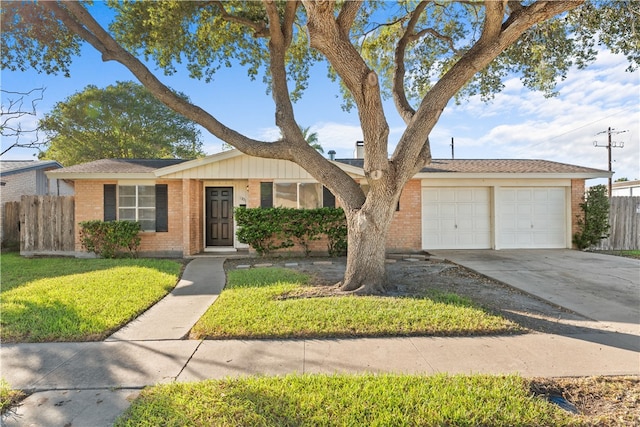 ranch-style house with a front lawn and a garage