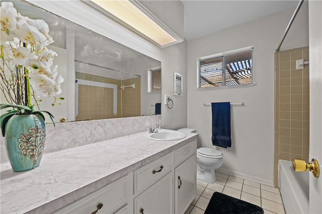 full bathroom with toilet, vanity, tiled shower / bath combo, and tile patterned floors