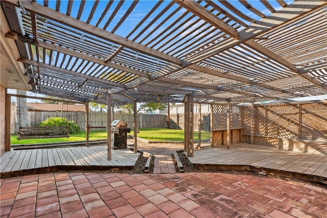 view of patio / terrace with a wooden deck, a pergola, and grilling area