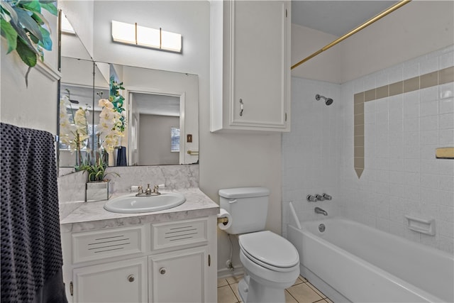 full bathroom with toilet, vanity, shower / bath combo with shower curtain, and tile patterned floors