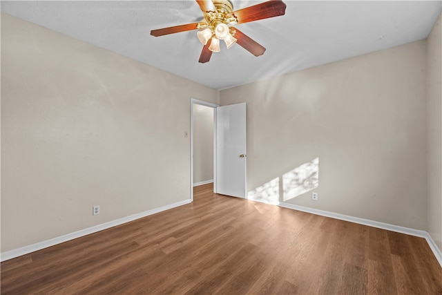 empty room with hardwood / wood-style flooring and ceiling fan