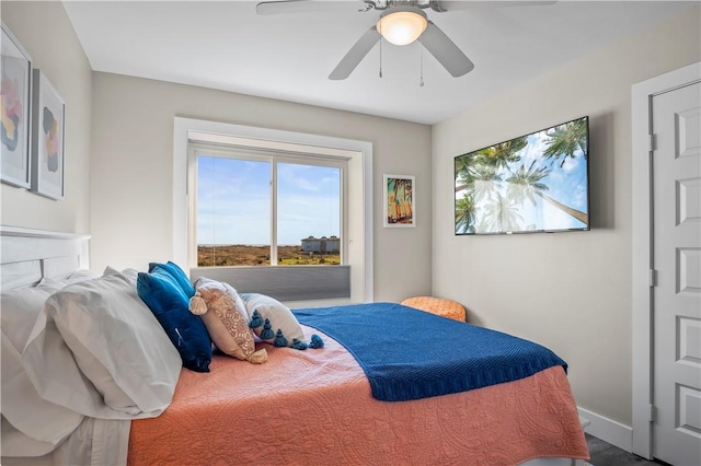 bedroom featuring ceiling fan and baseboards