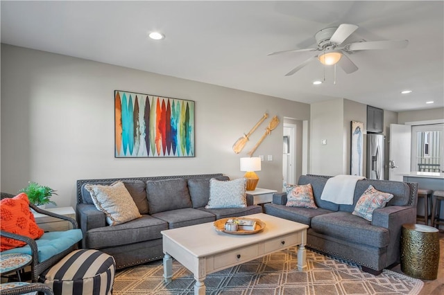 living room featuring ceiling fan and recessed lighting