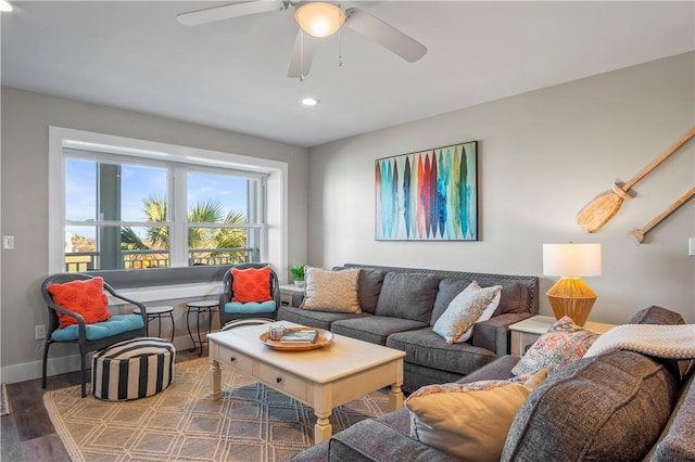 living room featuring ceiling fan, baseboards, wood finished floors, and recessed lighting