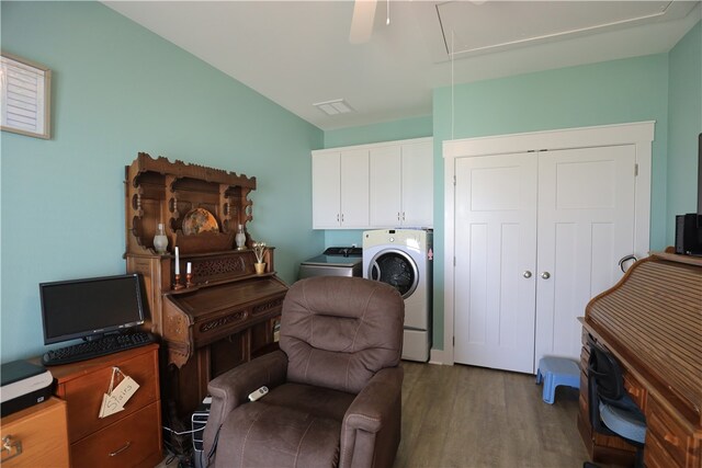 sitting room with hardwood / wood-style floors and washer and dryer