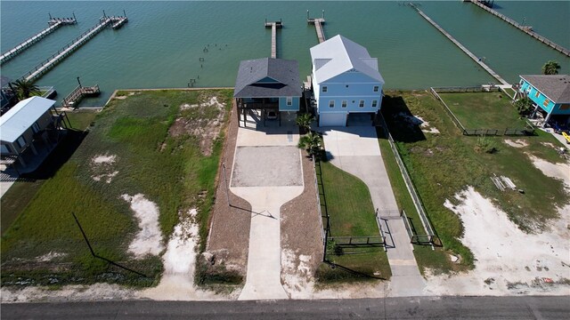 birds eye view of property featuring a water view