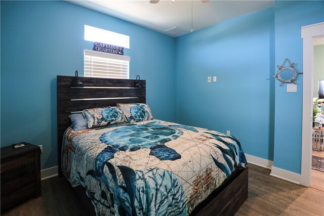 bedroom featuring dark wood-type flooring and ceiling fan