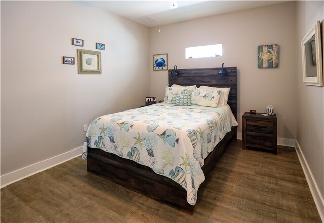 bedroom featuring dark hardwood / wood-style floors