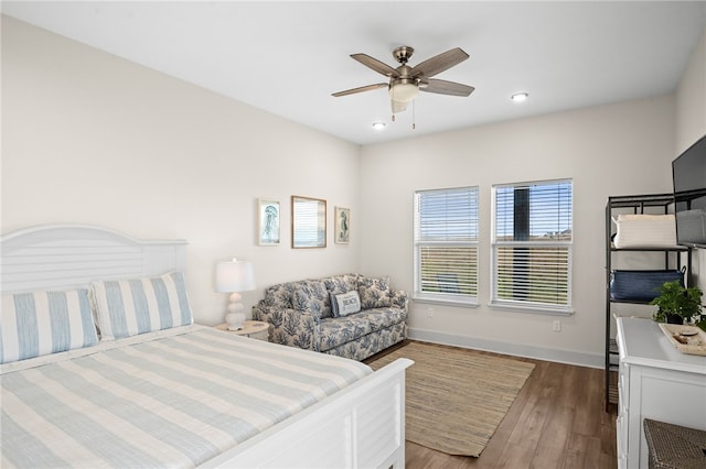 bedroom featuring hardwood / wood-style flooring and ceiling fan